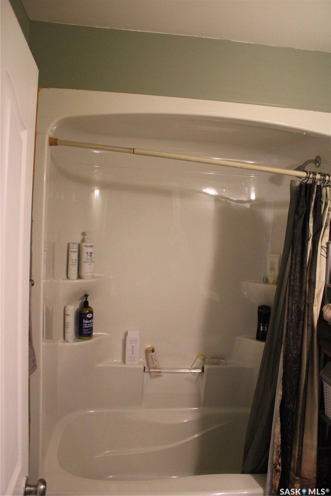 Bathroom featuring shower / bath combination with curtain