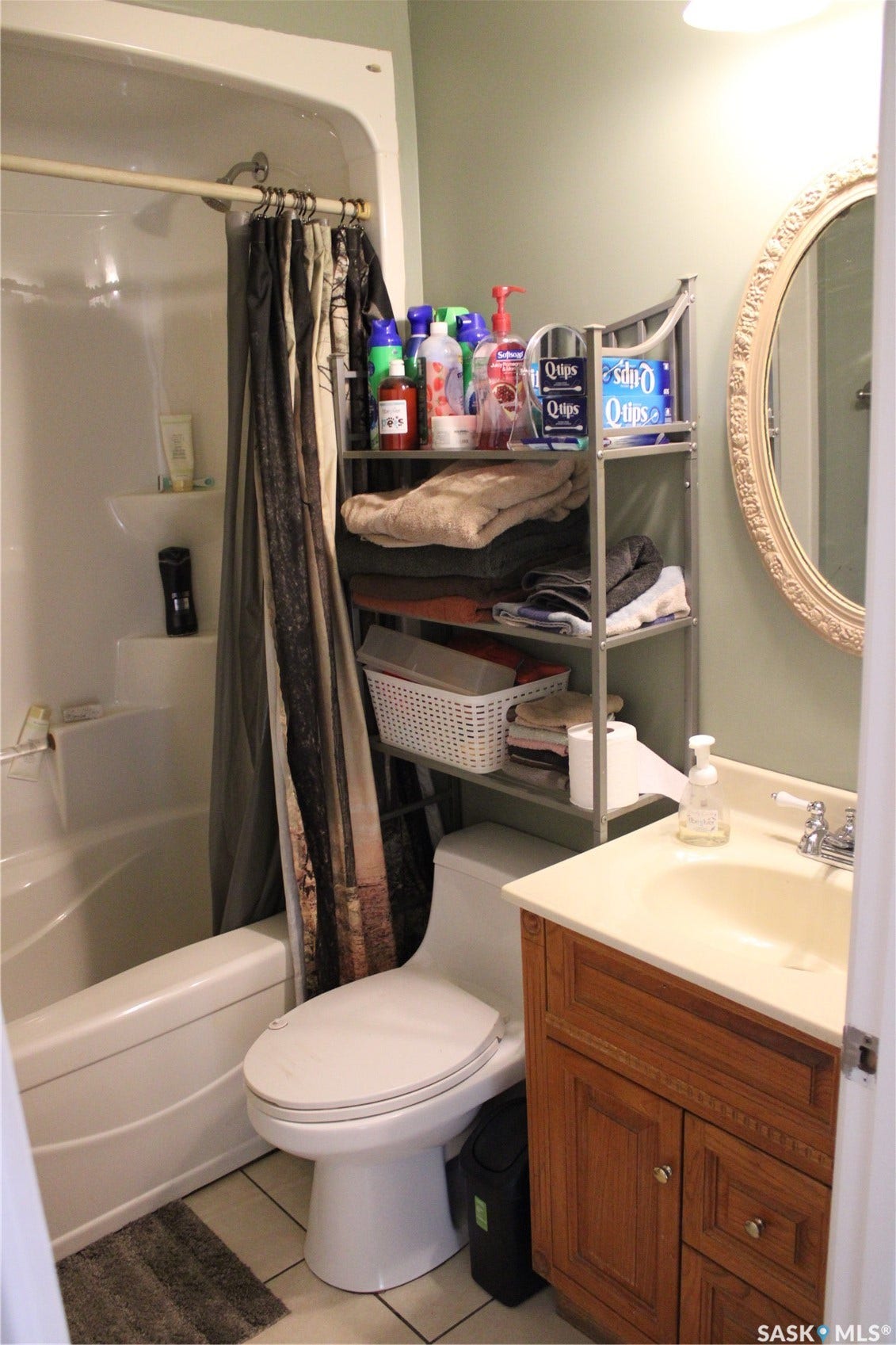 Full bathroom featuring vanity, tile patterned flooring, toilet, and shower / bath combo