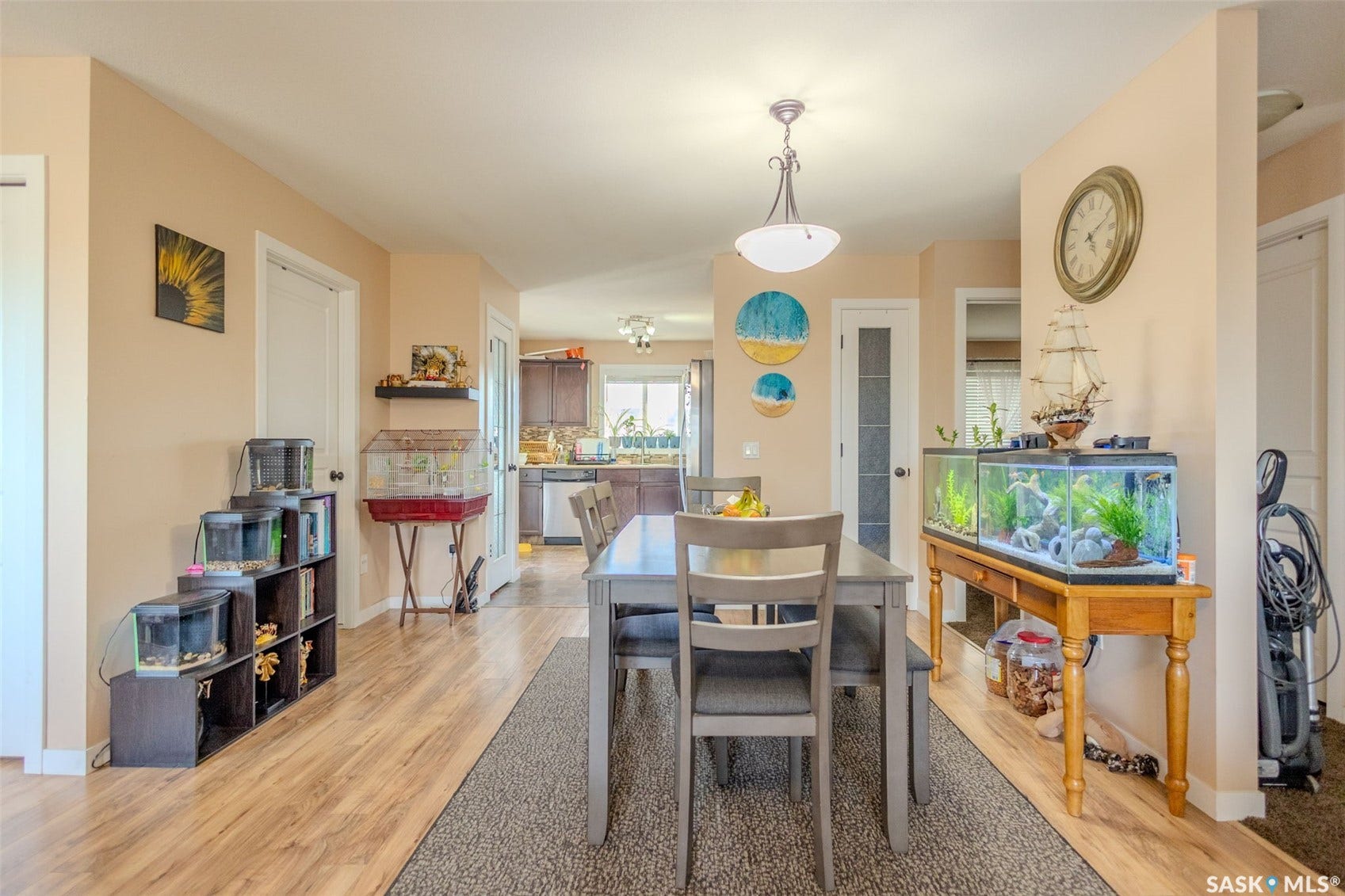 Wood-finish flooring throughout, with a semi-flush mount ceiling light fixture