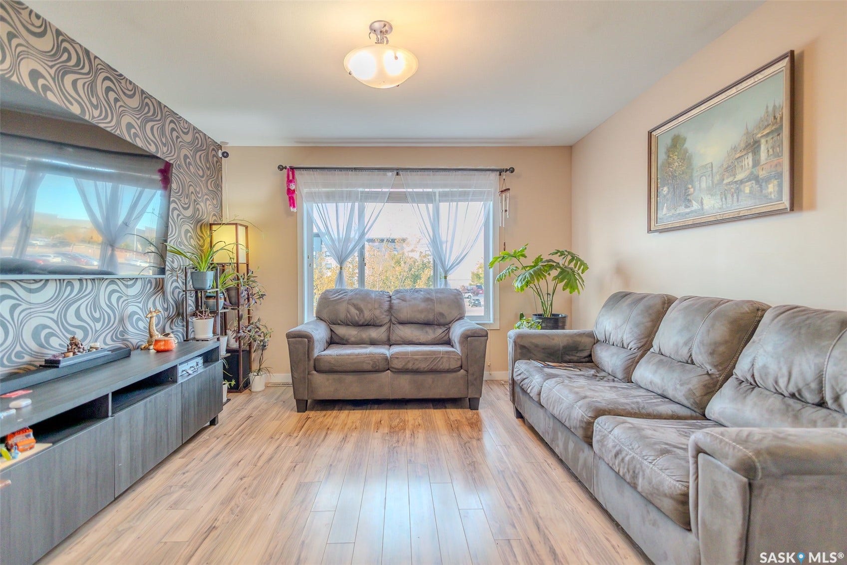 Wood-finish flooring throughout the space