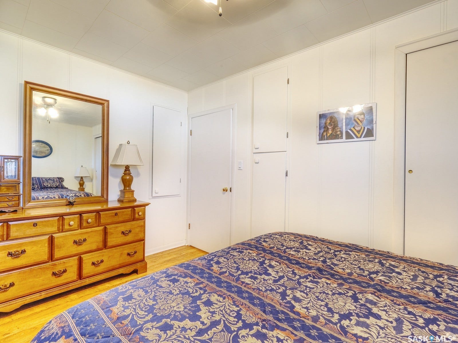 White paneled walls and wood-finish flooring