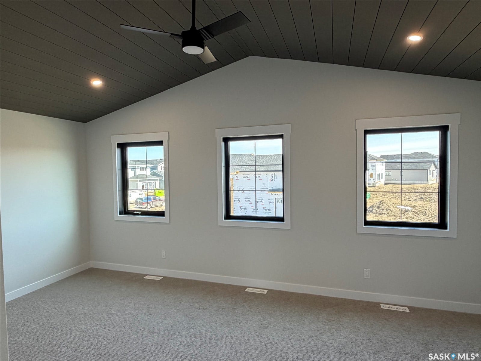 310 Traeger Manor, Saskatoon SK S7V 1Z4 Vaulted ceiling with dark wood-finish planking, recessed lighting, and a ceiling fan