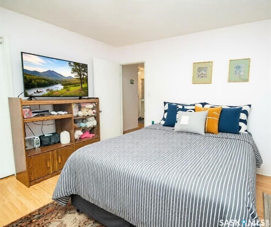 Hardwood-style flooring and bright white walls