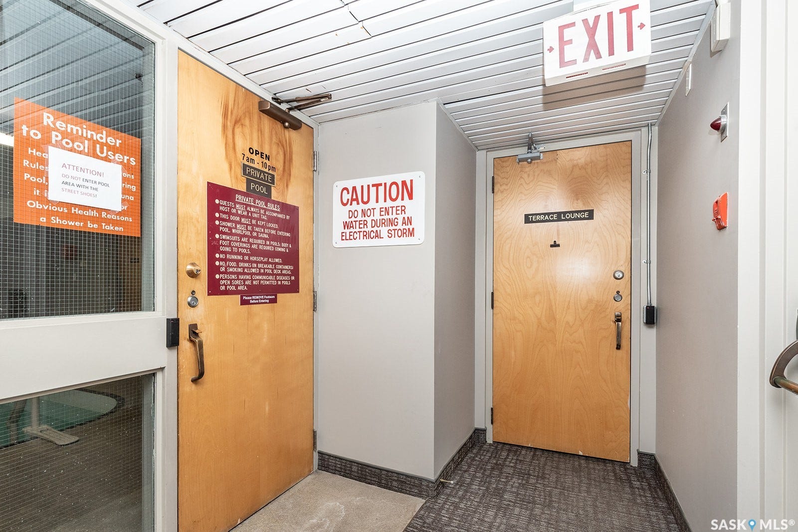 Entrance to indoor salt-water pool and hot tub, and entry to the lounge area