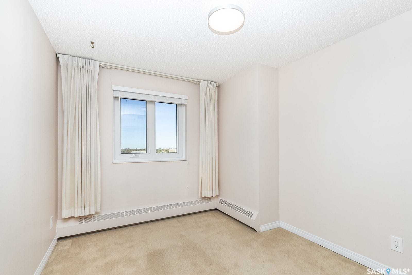 Second bedroom, wall-to-wall carpeting, and baseboard heating