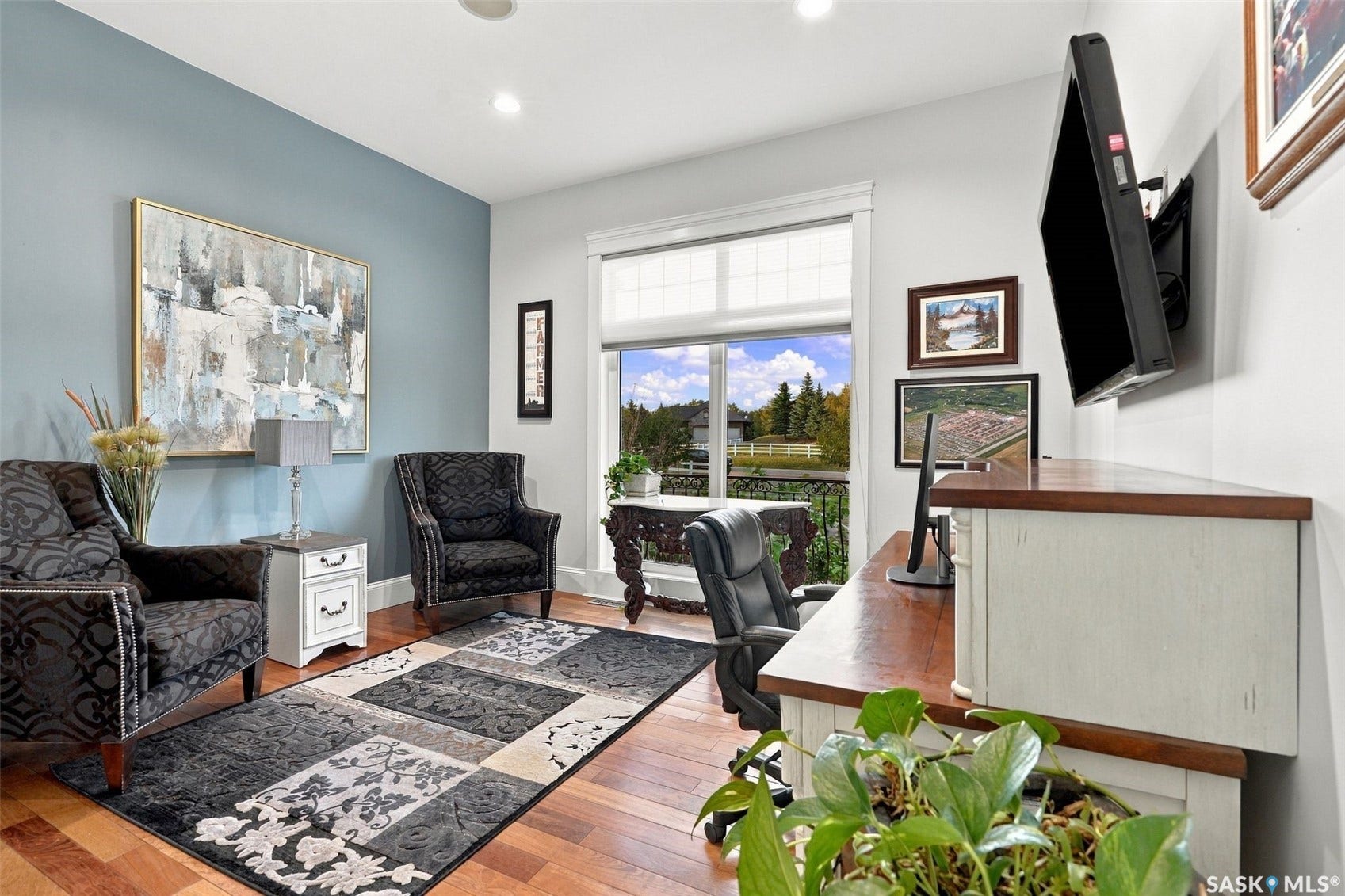 Wood-finish flooring with a light blue accent wall