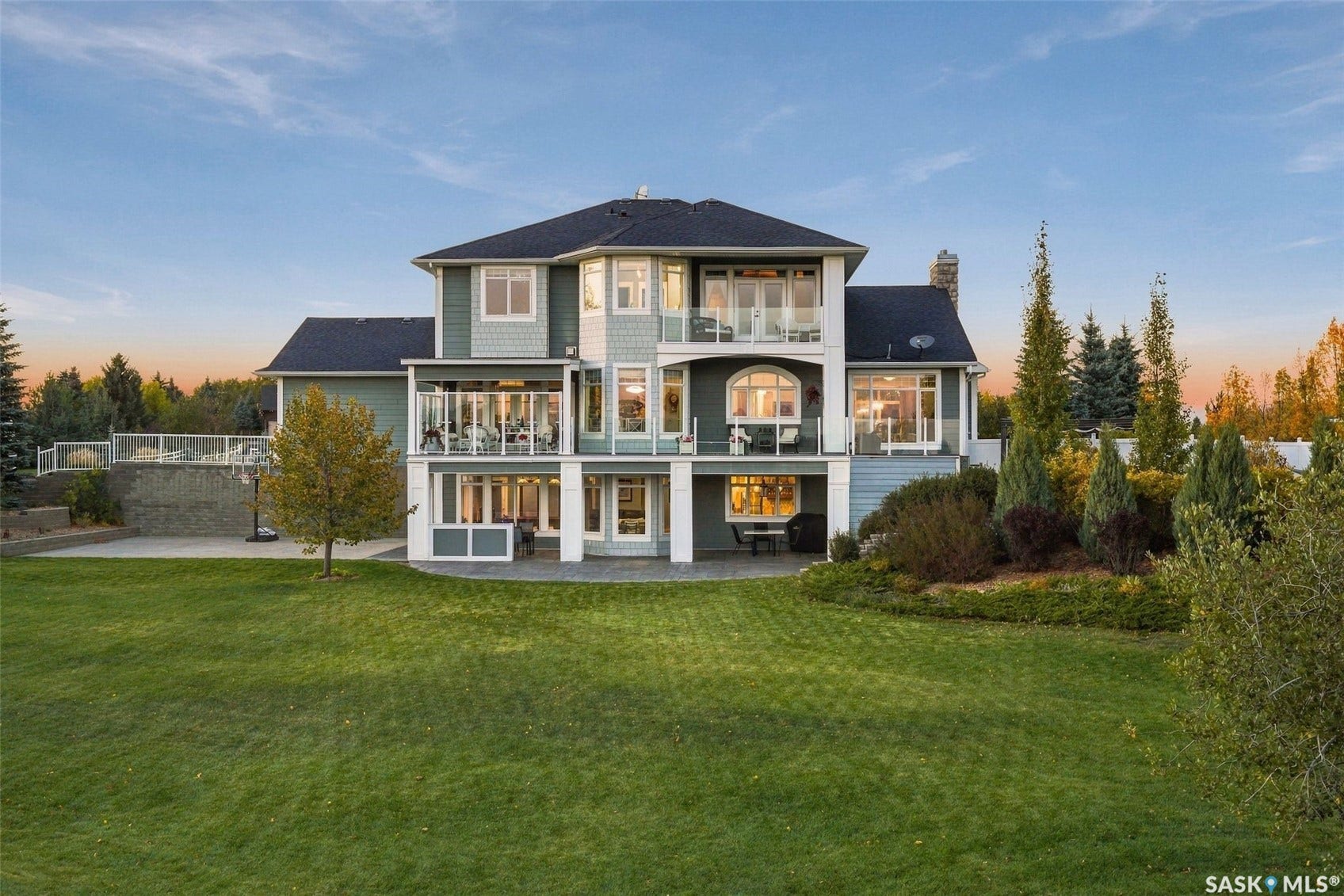 Expansive multi-level property with balconies and a patio