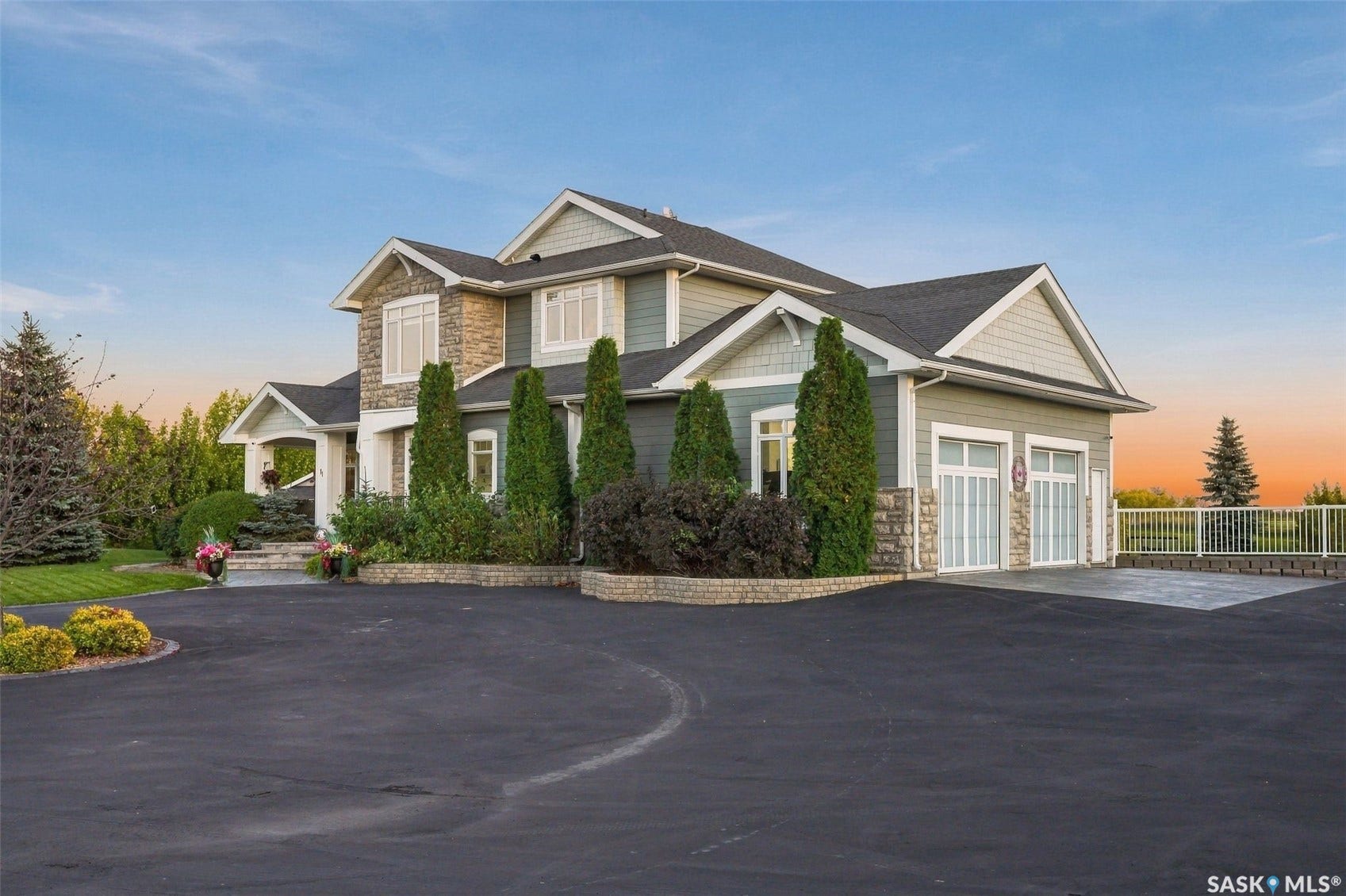 Stone and siding exterior with gabled roof lines