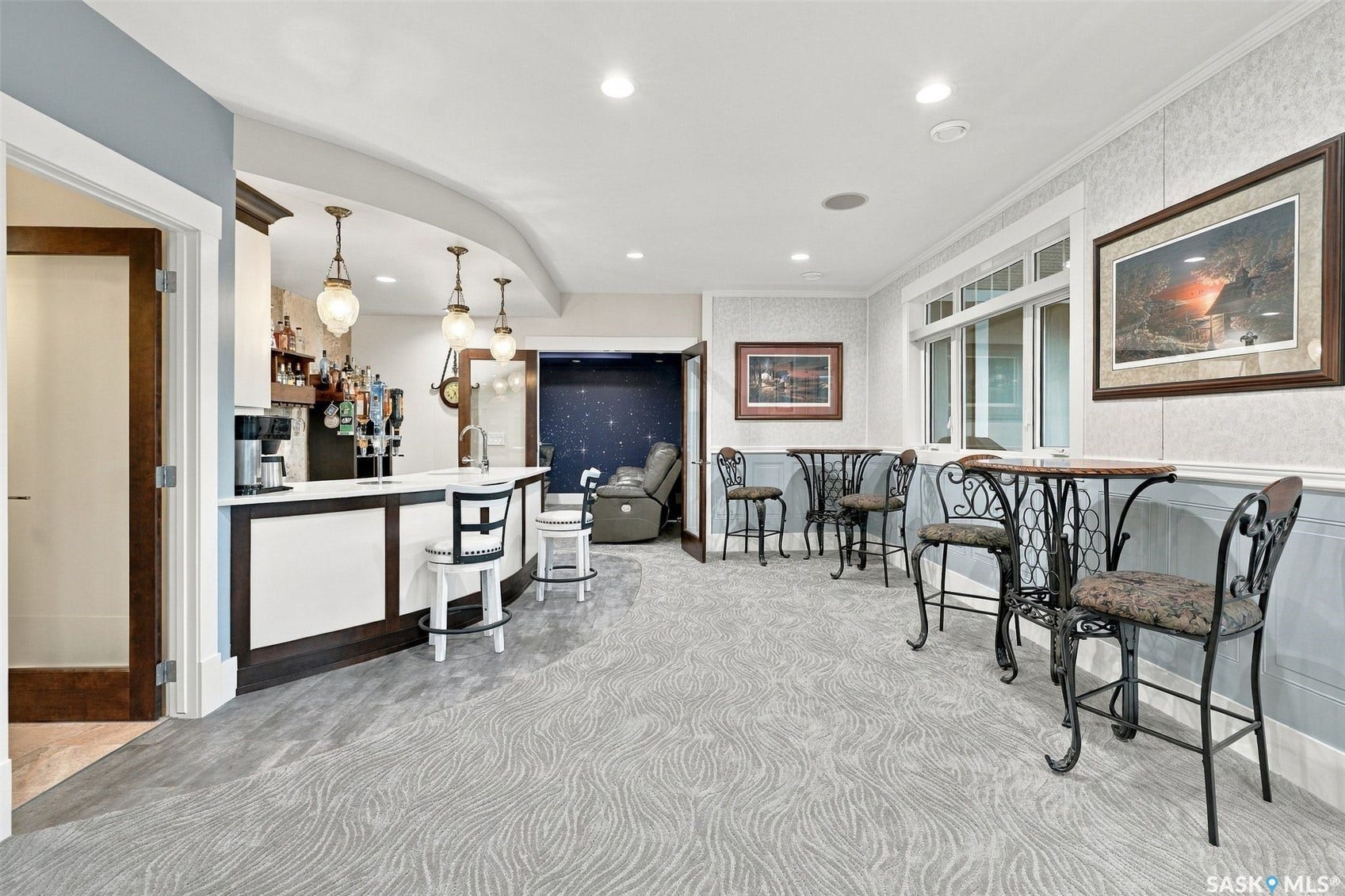 Walkout basement bar beside games room.