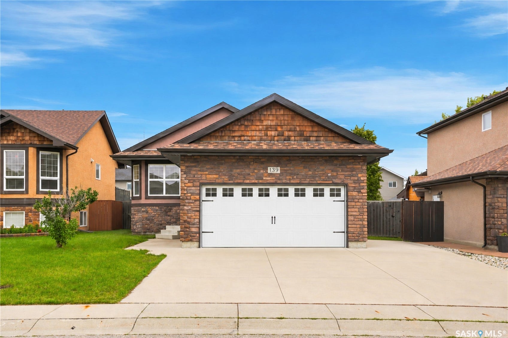 Brick and stone exterior with cedar shake accents