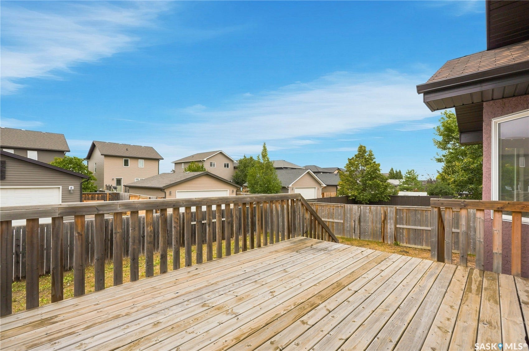 Expansive outdoor deck with wood railings