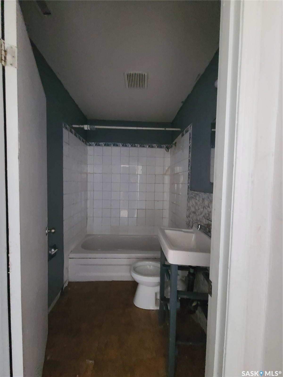 White tile surround bathtub