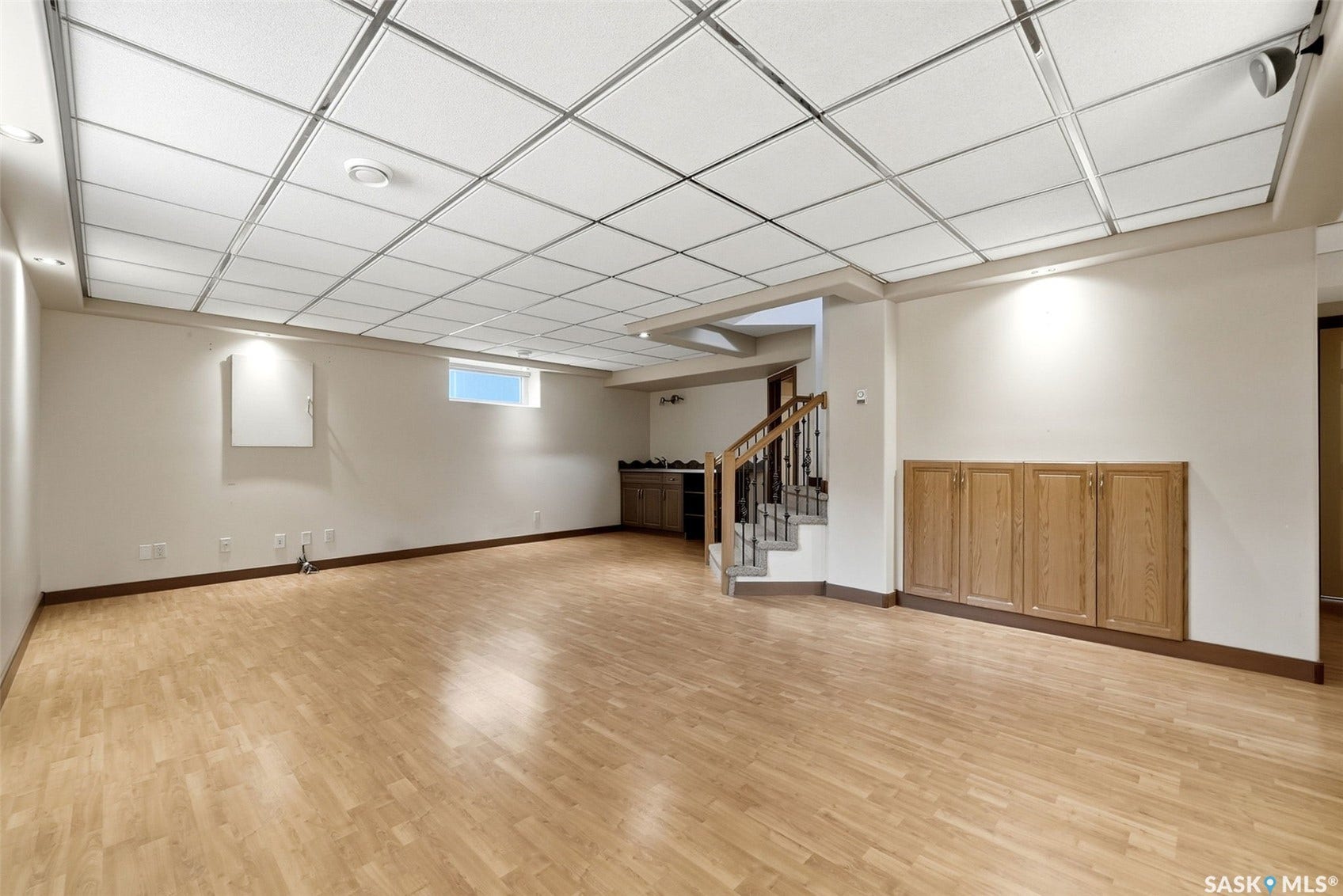 Wood-finish flooring with recessed lighting and track lighting