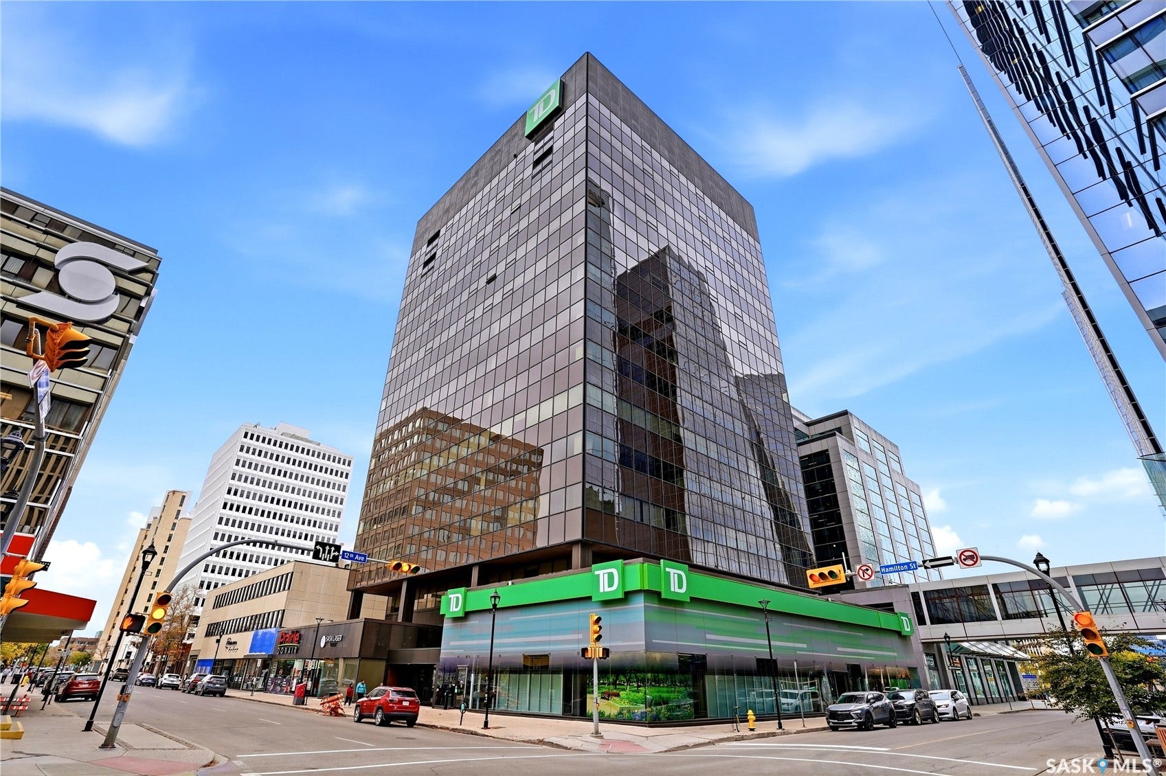 1914 Hamilton Street, #1007, Regina SK S4P 3N6 Multi-story commercial building featuring extensive glass curtain walls and a prominent ground-floor retail space