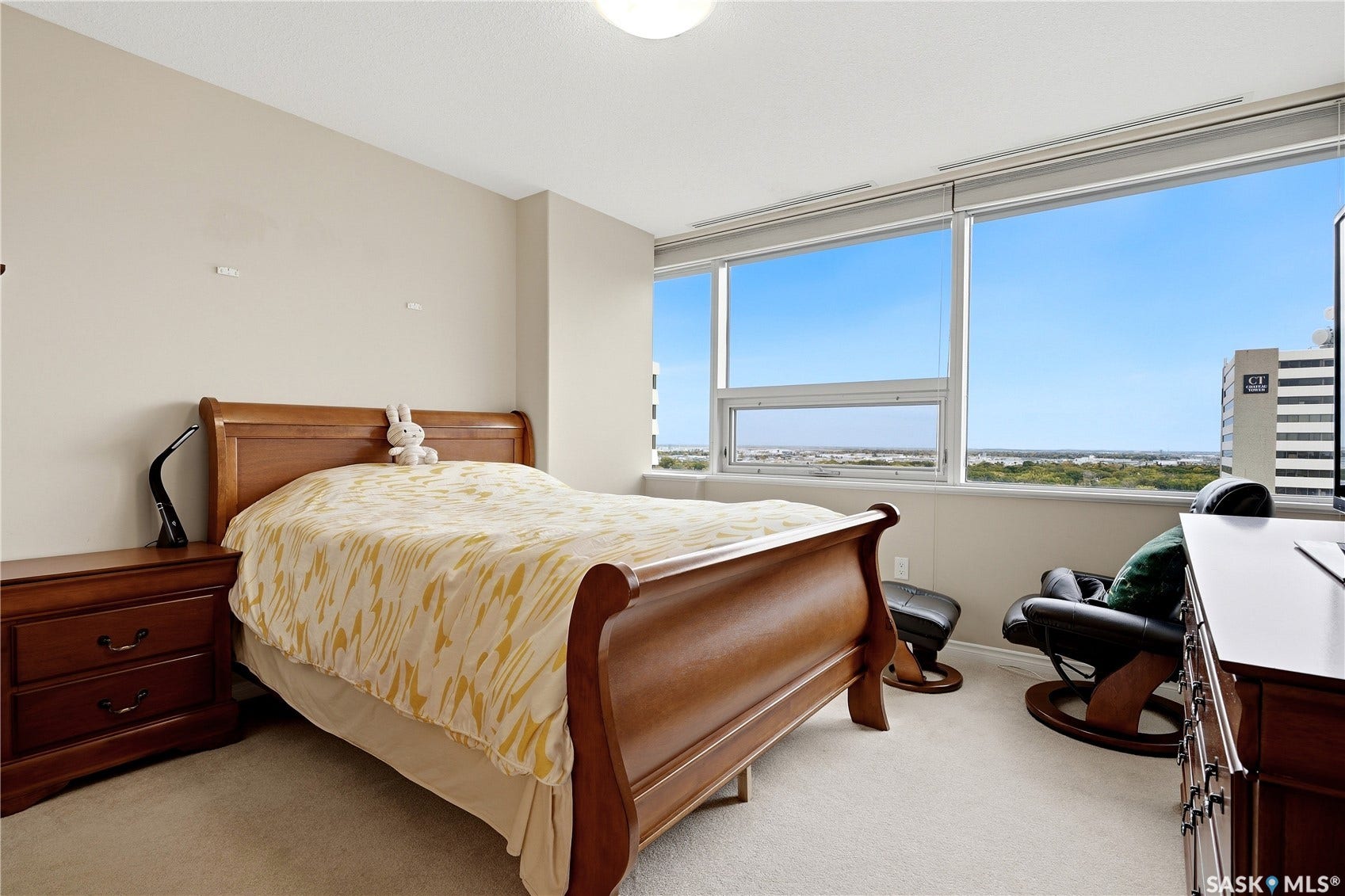 1914 Hamilton Street, #1007, Regina SK S4P 3N6 Wall-to-wall carpeting and large windows with roller shades