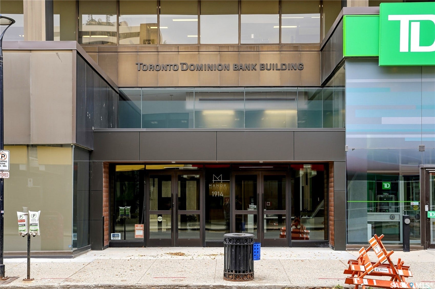 1914 Hamilton Street, #1007, Regina SK S4P 3N6 Multi-level building facade featuring extensive glazing, a prominent main entrance, and a modern commercial storefront