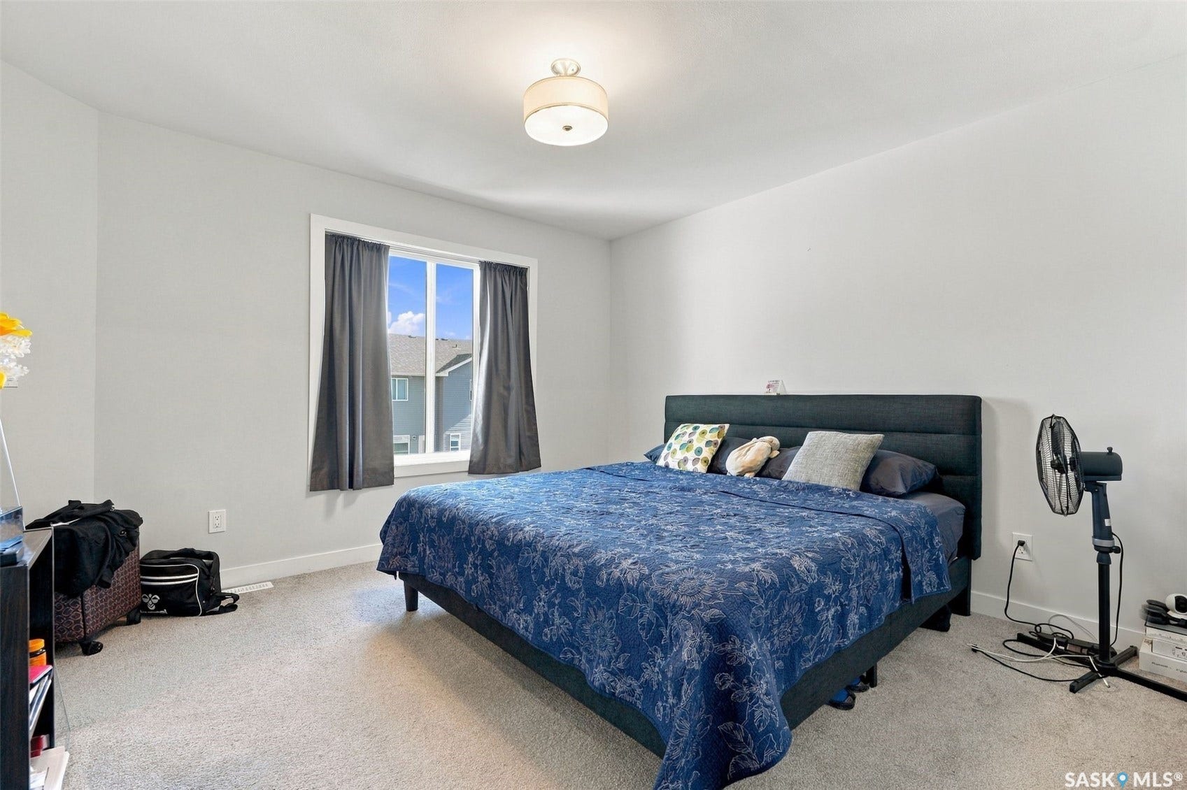 Recessed window with white trim, light gray walls, and carpeting