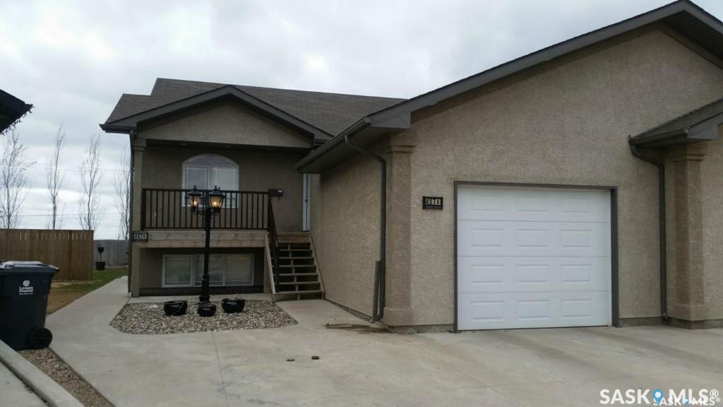 Attached single-car garage and concrete driveway