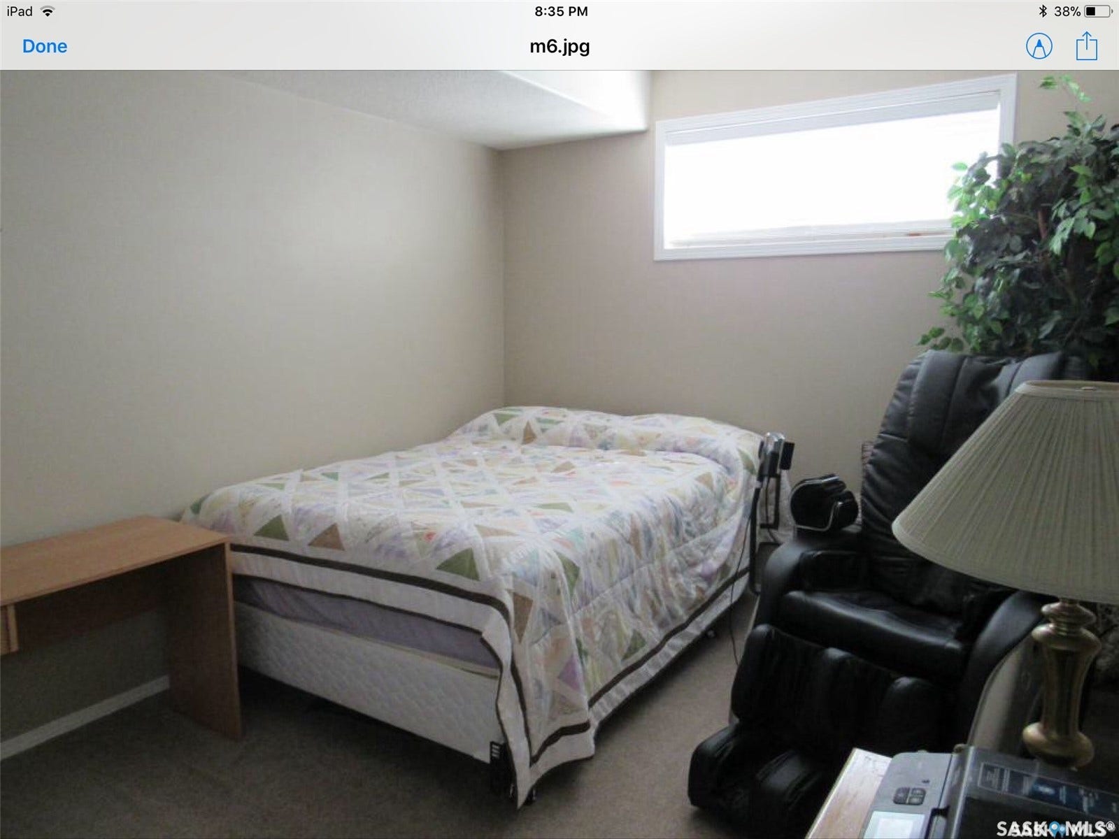 Wall-to-wall carpeting and a horizontal window