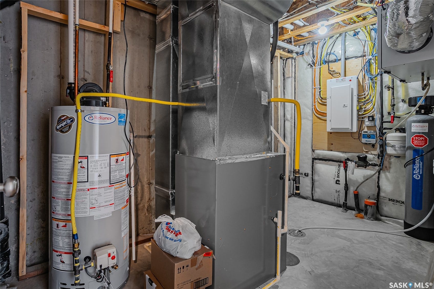Water heater, furnace, electrical panel, water filtration system, and concrete flooring