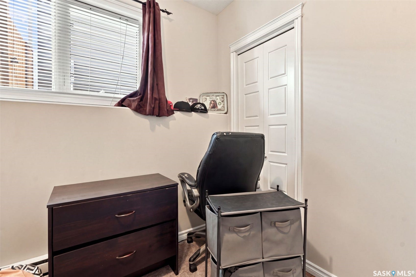 919 Kolynchuk Bend, Saskatoon SK S7T 0V9 Window with white blinds, neutral wall paint, and white trim