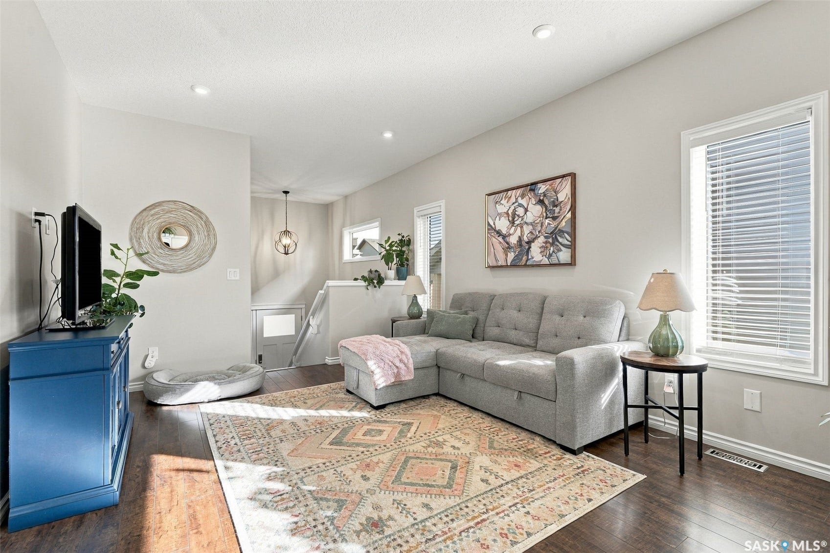 919 Kolynchuk Bend, Saskatoon SK S7T 0V9 Wood-finish flooring throughout, bright white walls, and recessed lighting