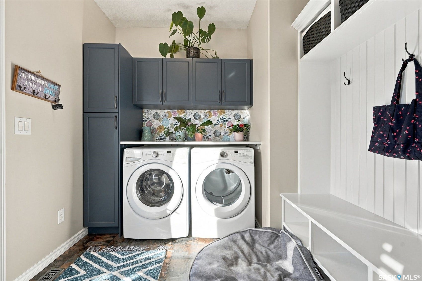 919 Kolynchuk Bend, Saskatoon SK S7T 0V9 Built-in storage solutions with dark cabinetry, white shelving, and coat hooks
