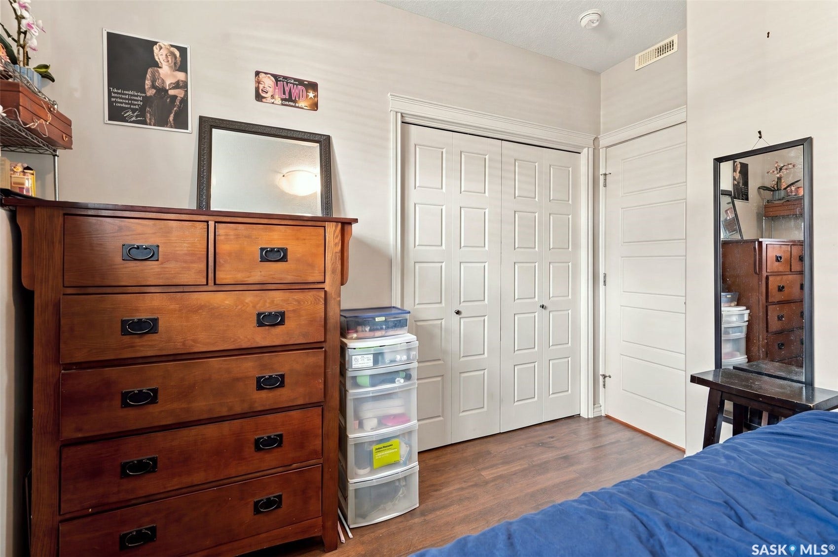 919 Kolynchuk Bend, Saskatoon SK S7T 0V9 Wood-finish flooring with light-colored walls