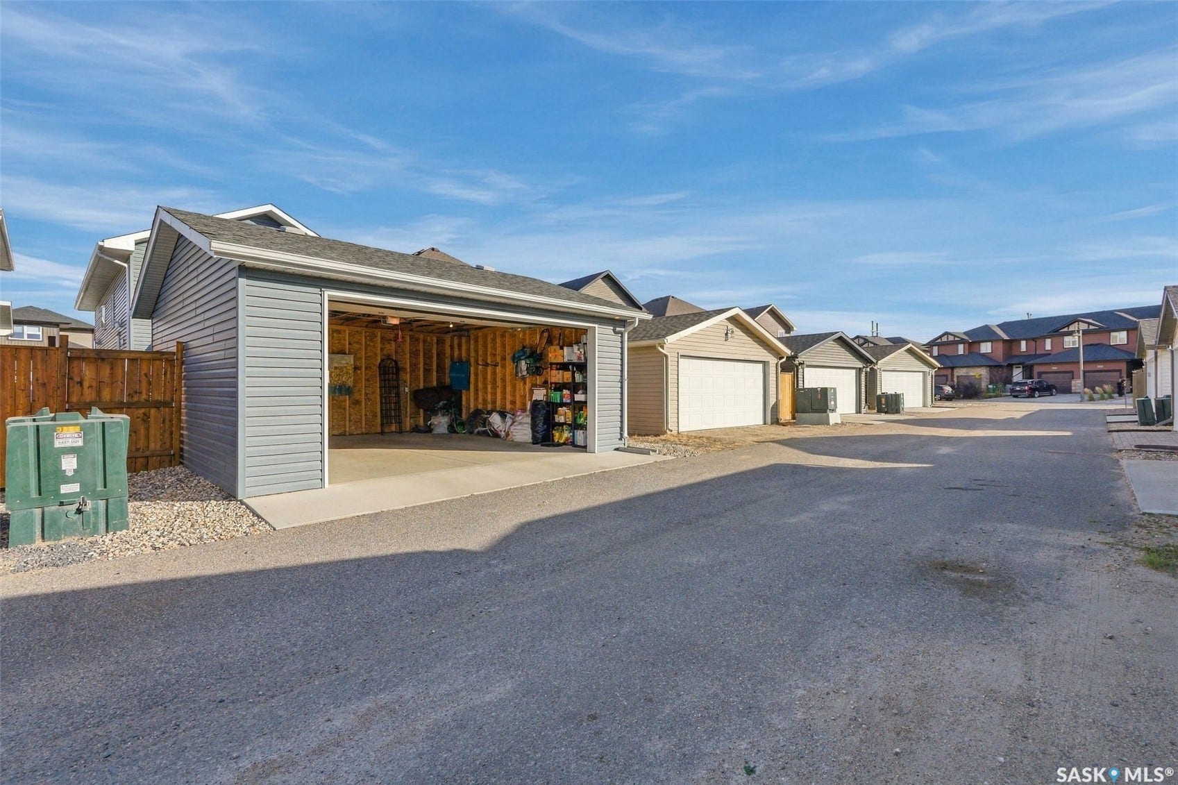 919 Kolynchuk Bend, Saskatoon SK S7T 0V9 Detached single-car garage featuring siding exterior, shingle roof, and a concrete floor