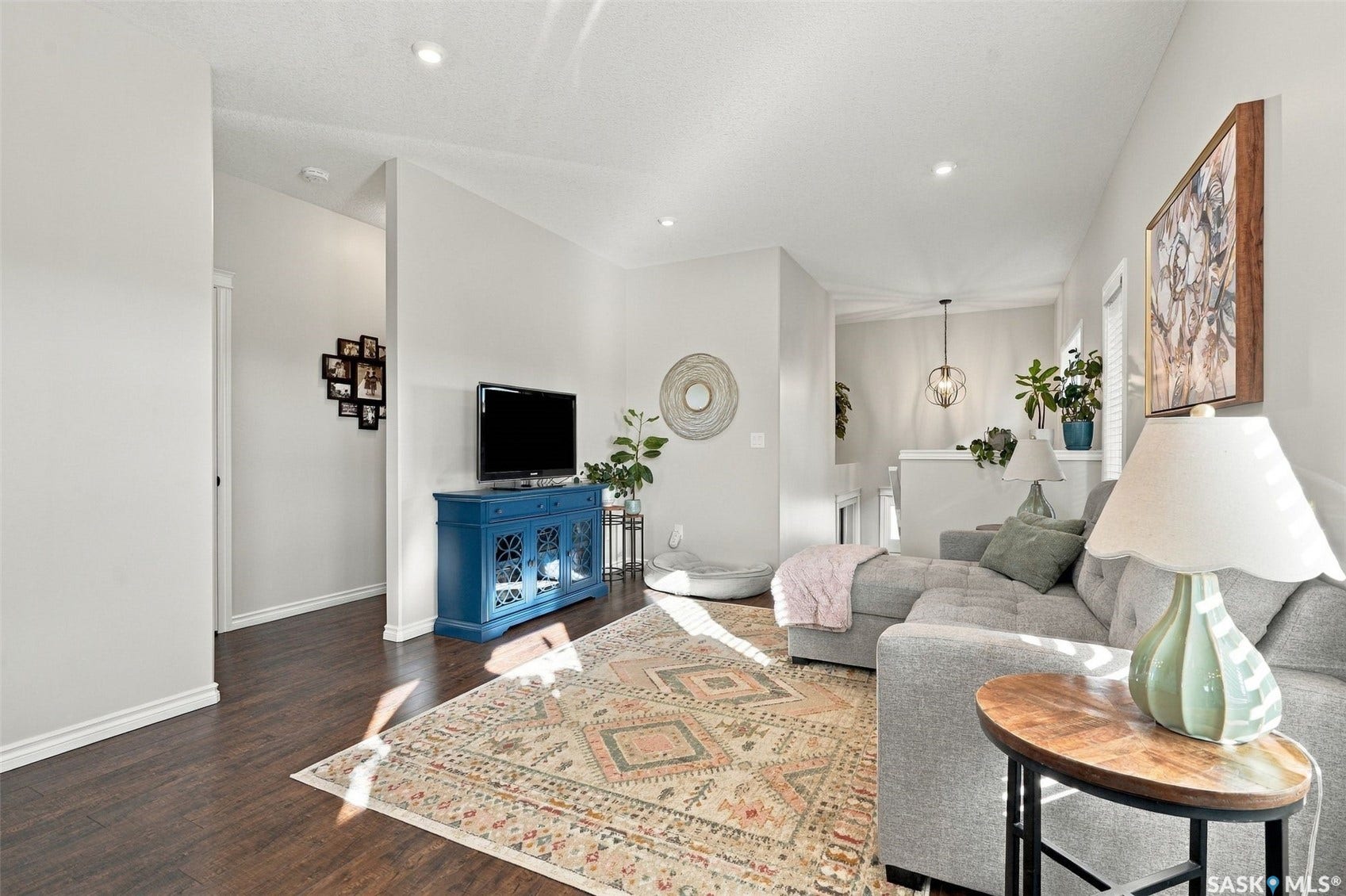 919 Kolynchuk Bend, Saskatoon SK S7T 0V9 Recessed ceiling lighting, dark wood-finish flooring, and light wall tones