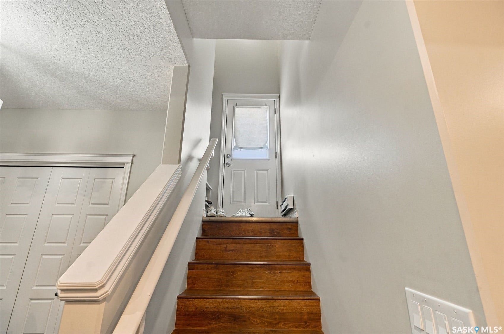 919 Kolynchuk Bend, Saskatoon SK S7T 0V9 Wood-finish stairs with white painted railing