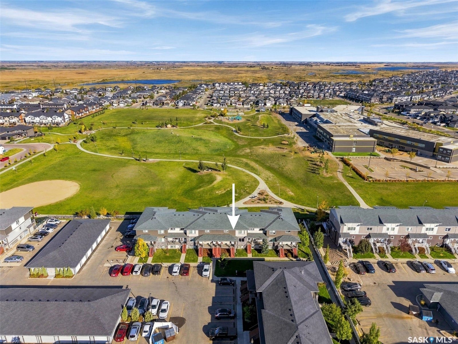 Townhome property with direct access to a community green space and paved walking paths