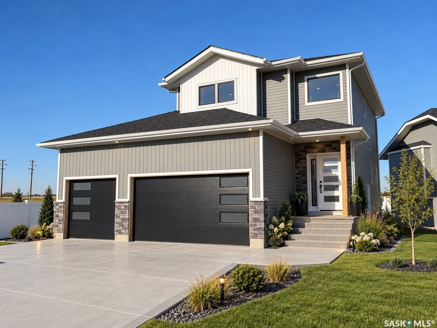 Contemporary exterior featuring mixed material siding and stone accents
