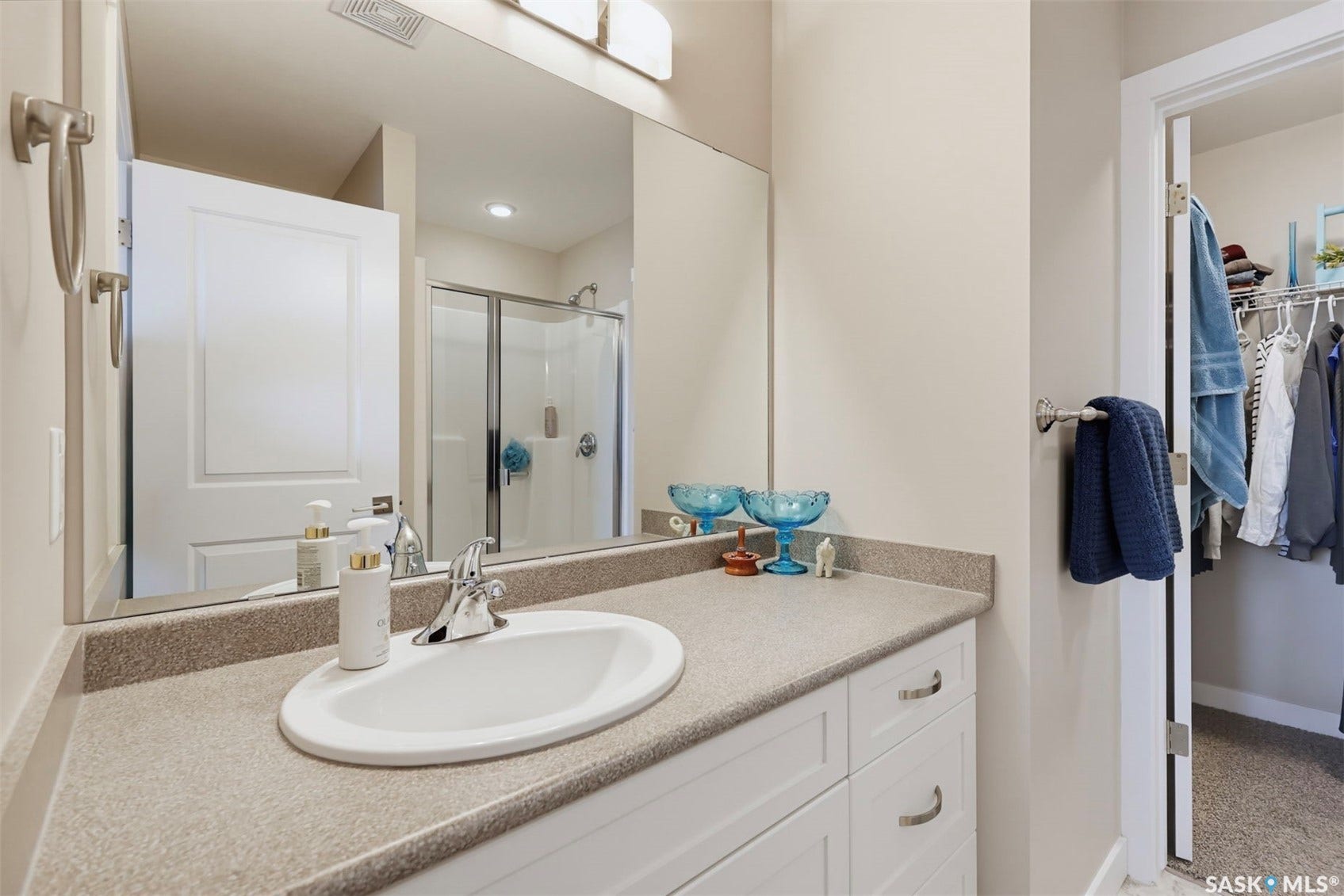 Bathroom vanity with an integrated sink and chrome faucet