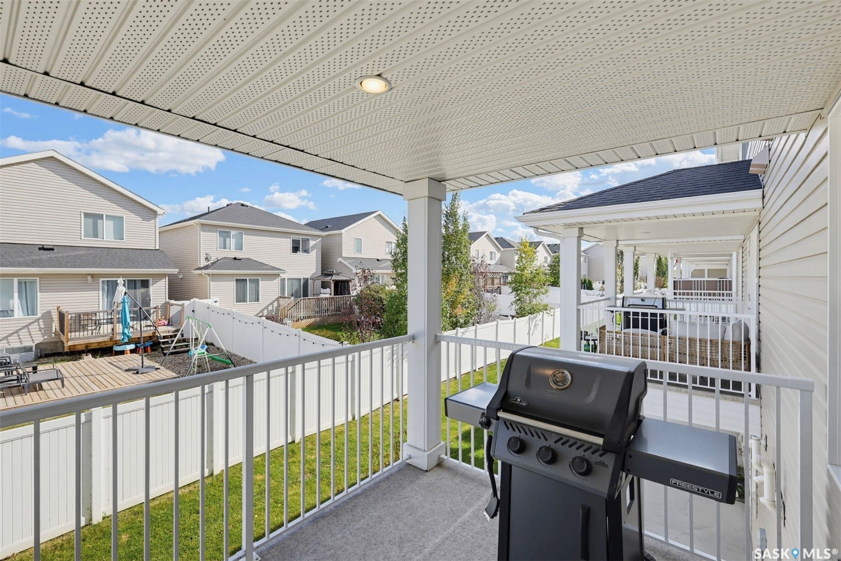 Covered balcony with a textured ceiling and recessed lighting