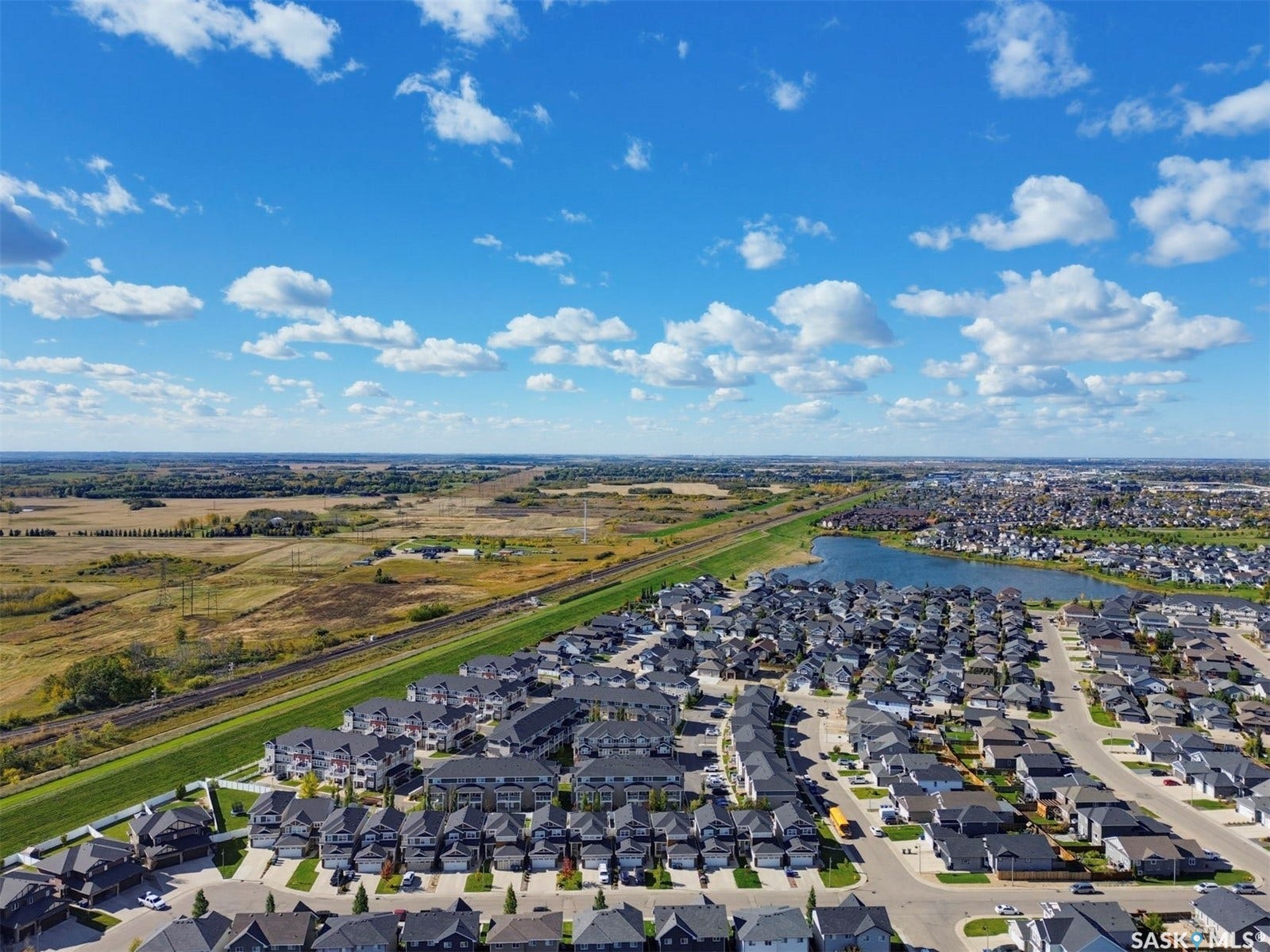 Expansive residential development featuring a large central pond