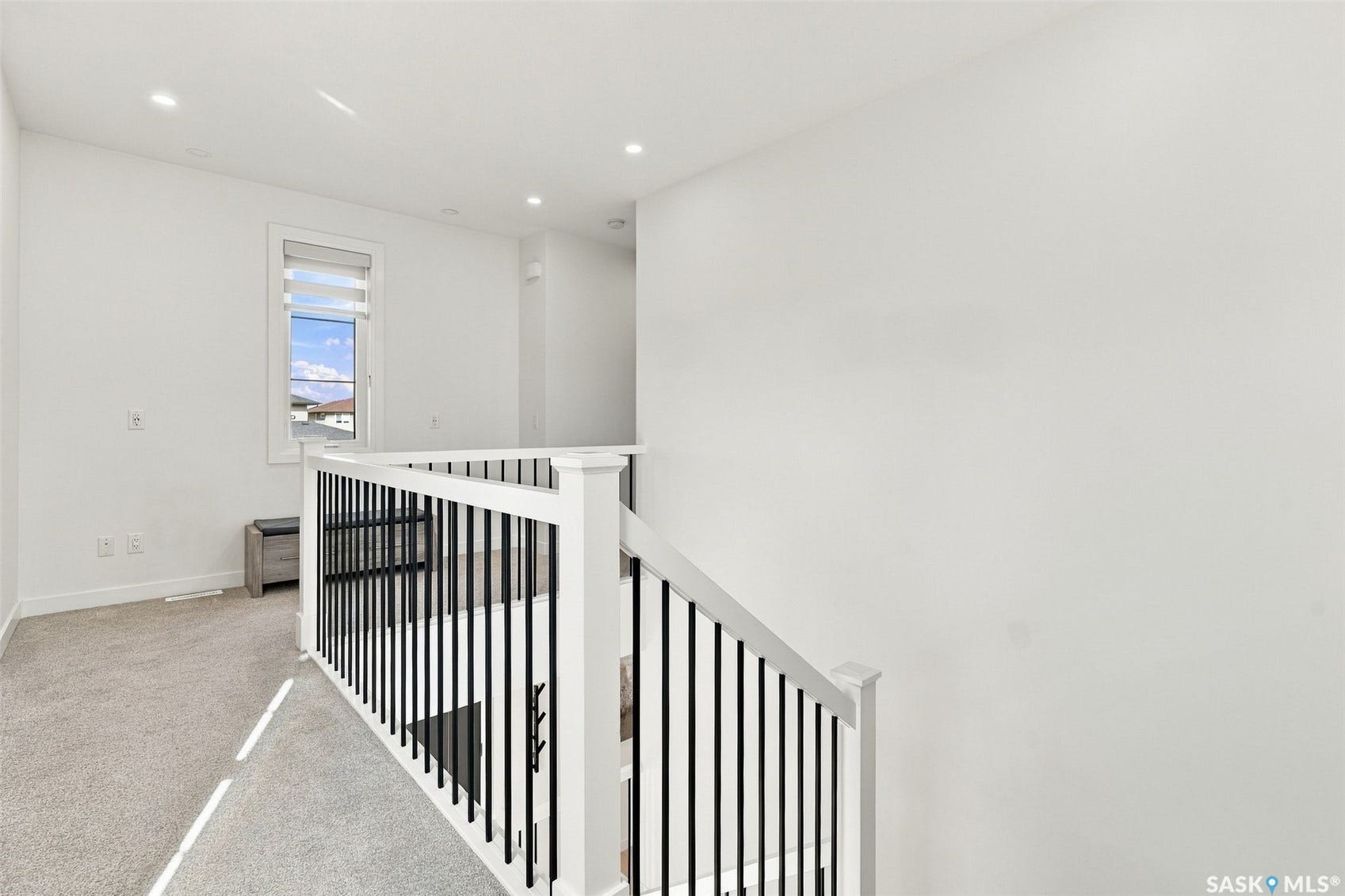 6221 Koep Avenue, Regina SK S4X 0J2 Carpeted landing with recessed lighting, white walls, and a window with blinds