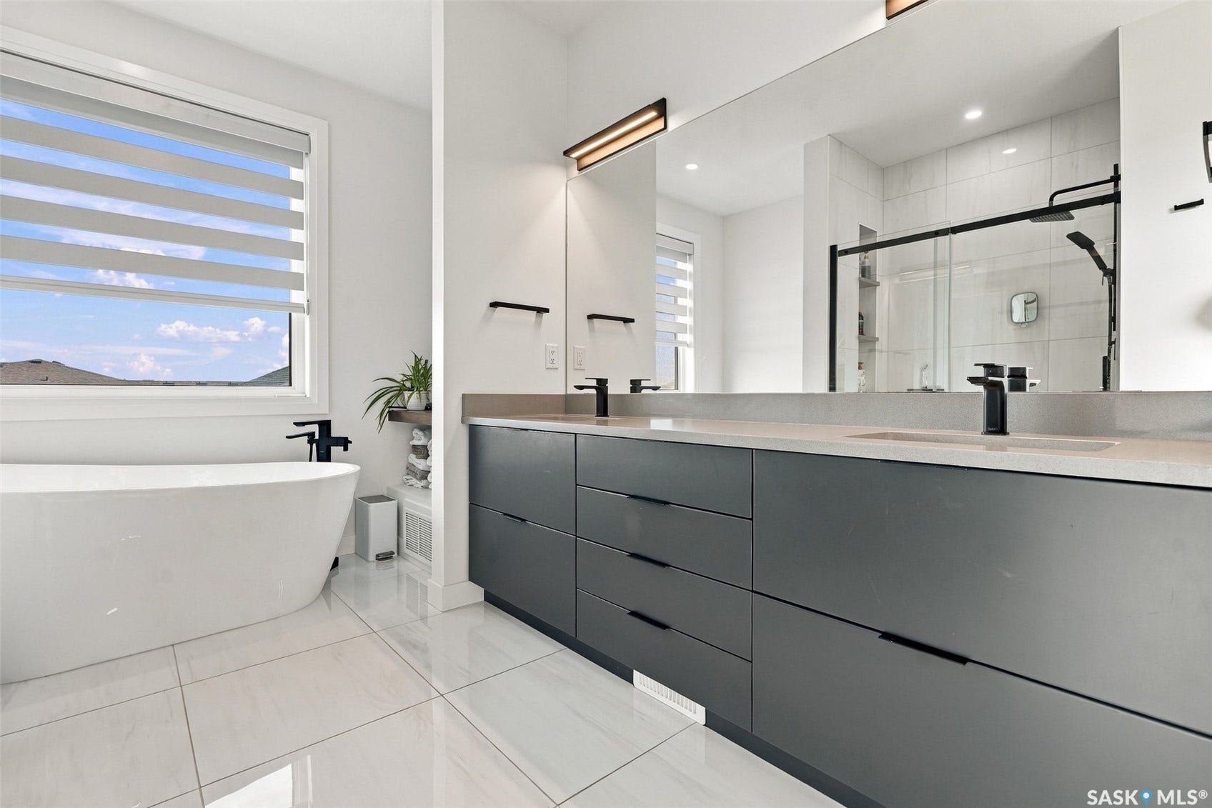 6221 Koep Avenue, Regina SK S4X 0J2 White freestanding bathtub and large format tile flooring