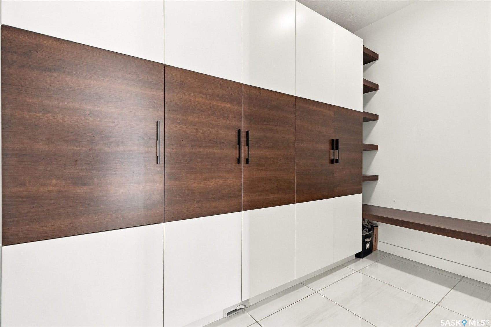 6221 Koep Avenue, Regina SK S4X 0J2 Integrated white and wood-finish cabinetry with linear black hardware