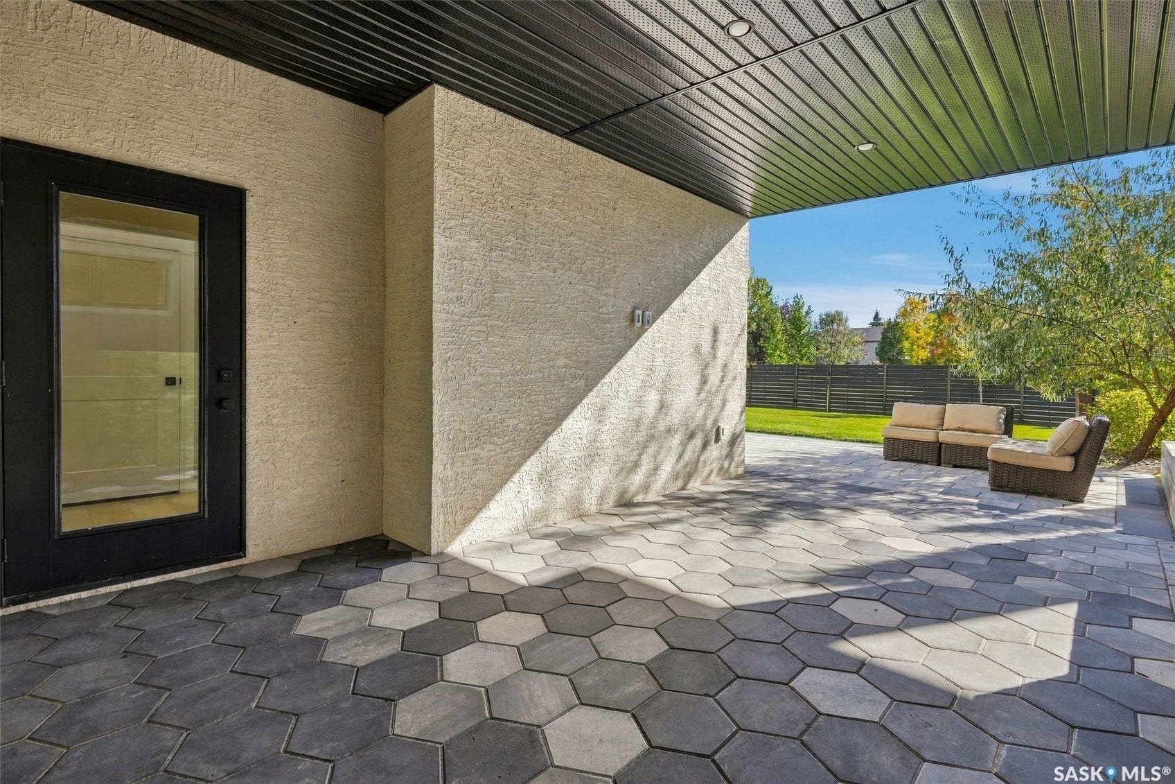 6221 Koep Avenue, Regina SK S4X 0J2 Covered patio featuring a black slatted ceiling and recessed lighting
