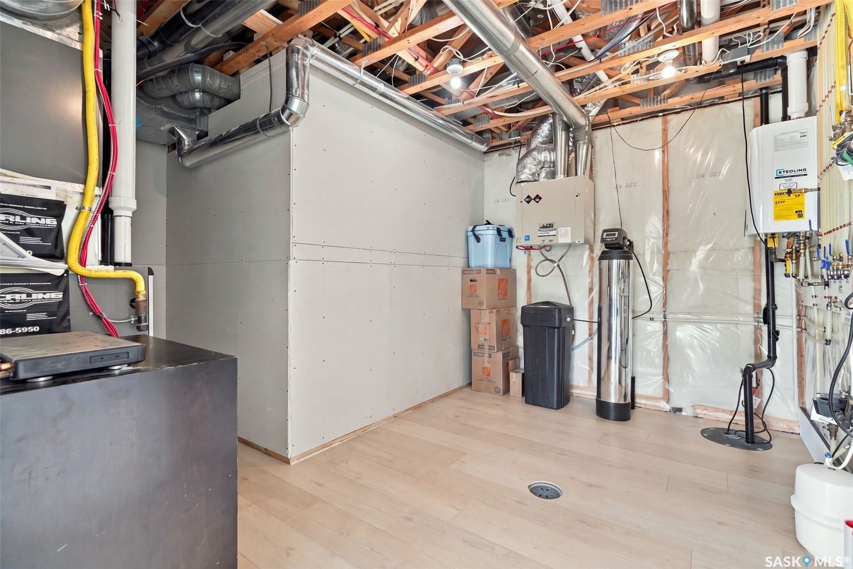 6221 Koep Avenue, Regina SK S4X 0J2 Wood-finish flooring with floor drain