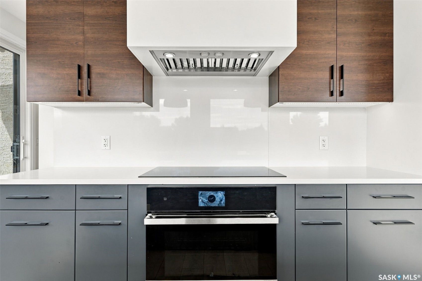 6221 Koep Avenue, Regina SK S4X 0J2 Built-in stainless steel oven, cooktop, and range hood