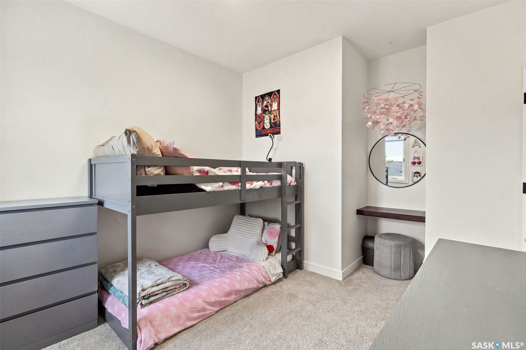 6221 Koep Avenue, Regina SK S4X 0J2 Neutral wall paint, carpet flooring, a built-in niche with a wood-finish shelf, and a ceiling-mounted light fixture