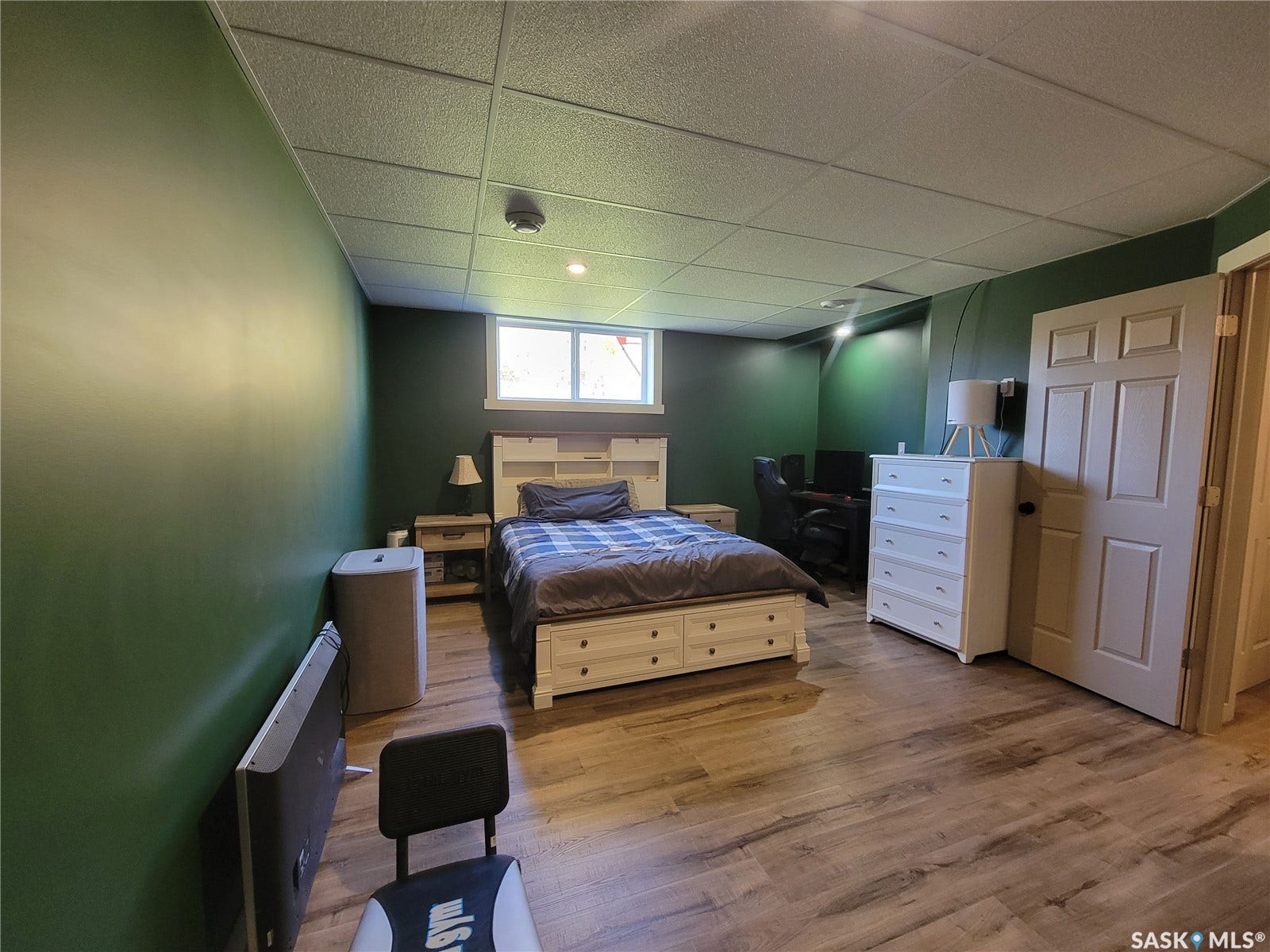 Wood-finish flooring throughout, recessed lighting, and a drop ceiling