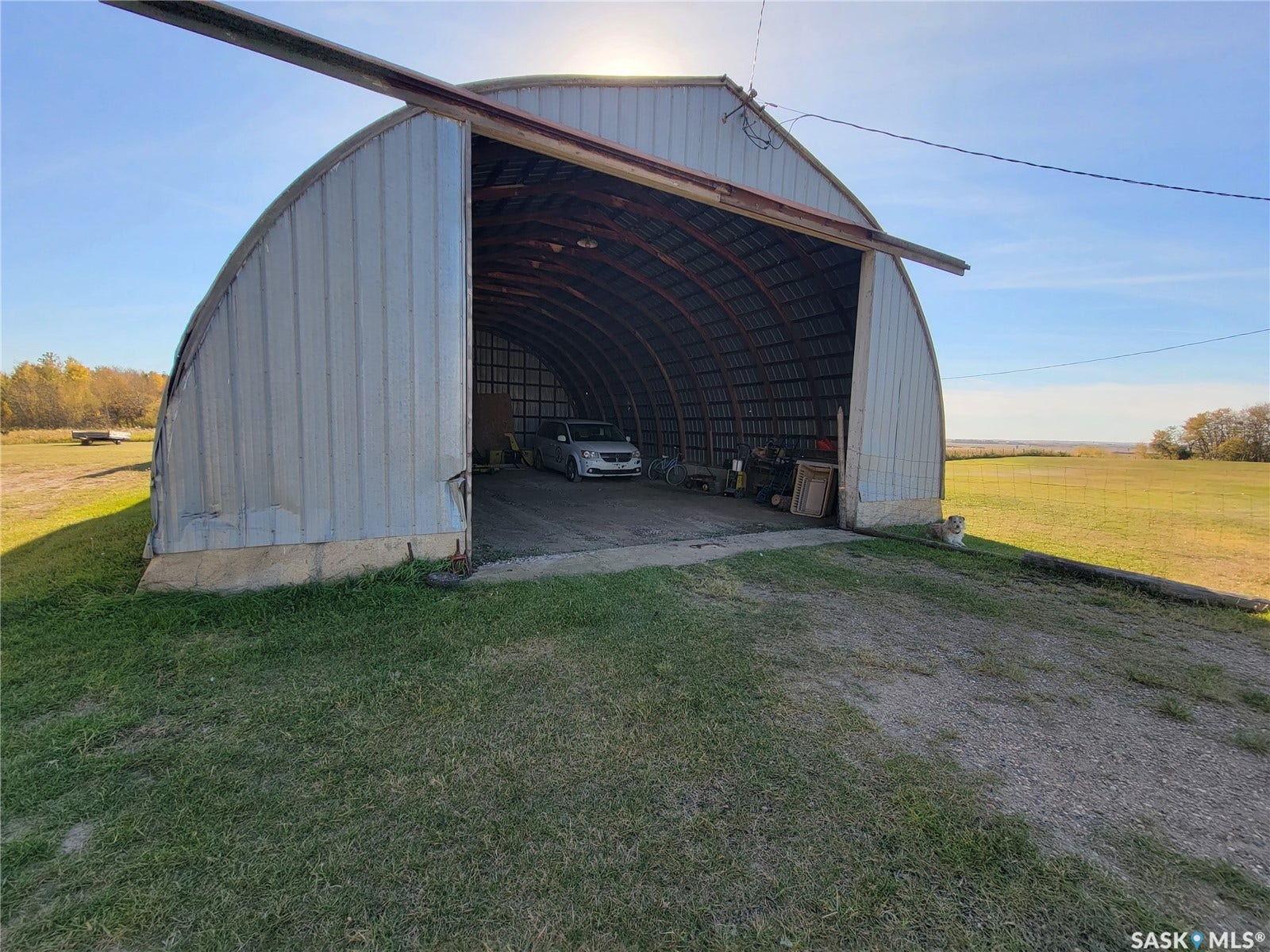 Metal arch-style building with a concrete foundation