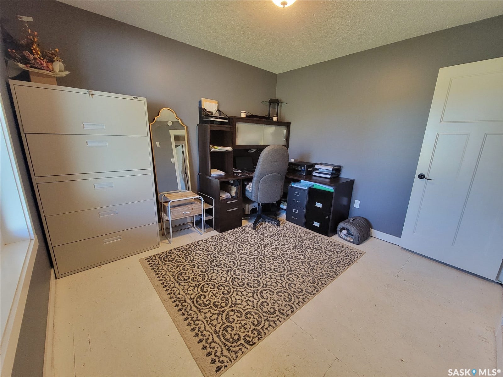 Recessed ceiling lighting, light-toned flooring, and neutral wall paint