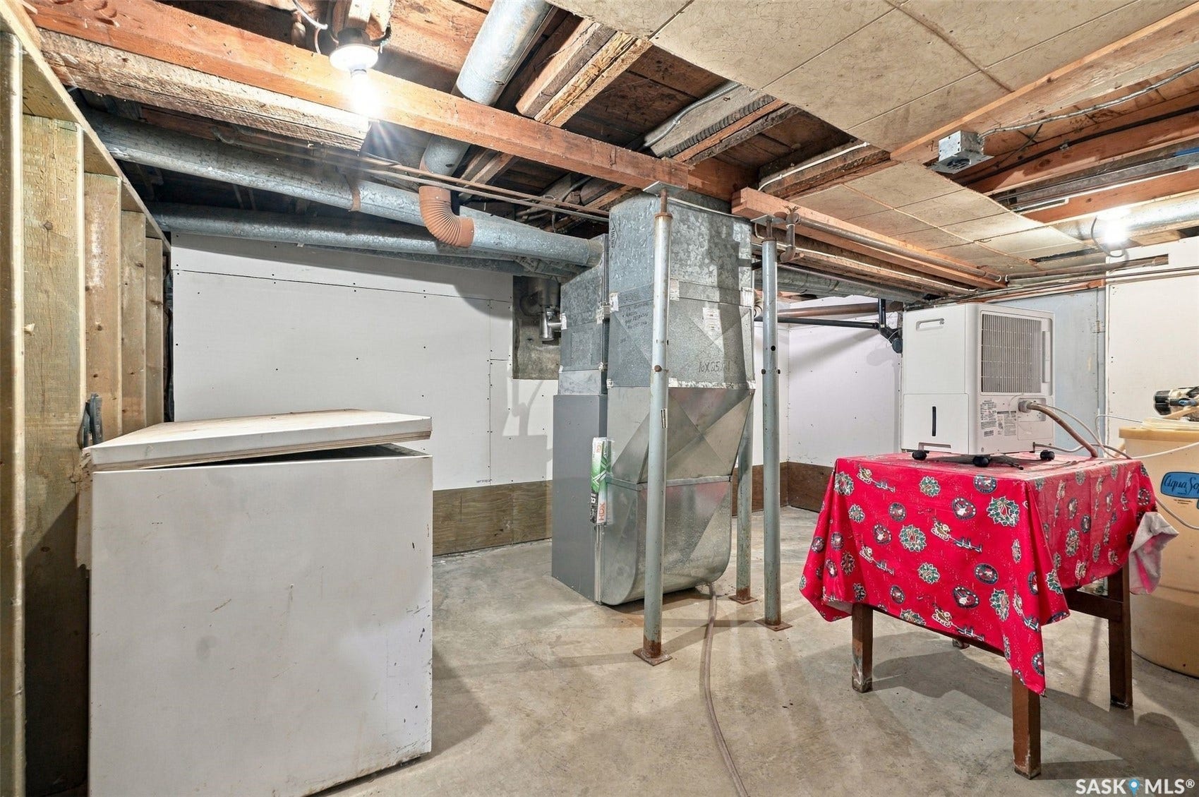 Concrete flooring with exposed ceiling joists and ductwork