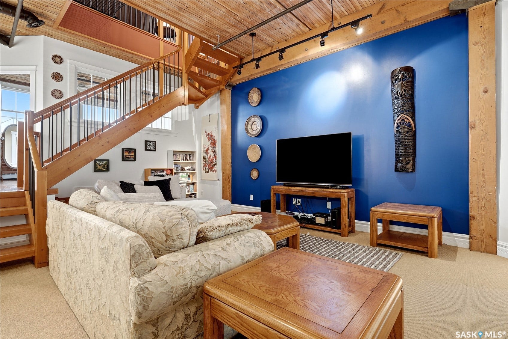 Exposed wood beam ceiling with track lighting