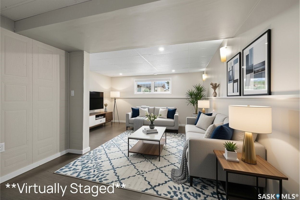 Recessed lighting, wood-finish flooring, and light-toned walls