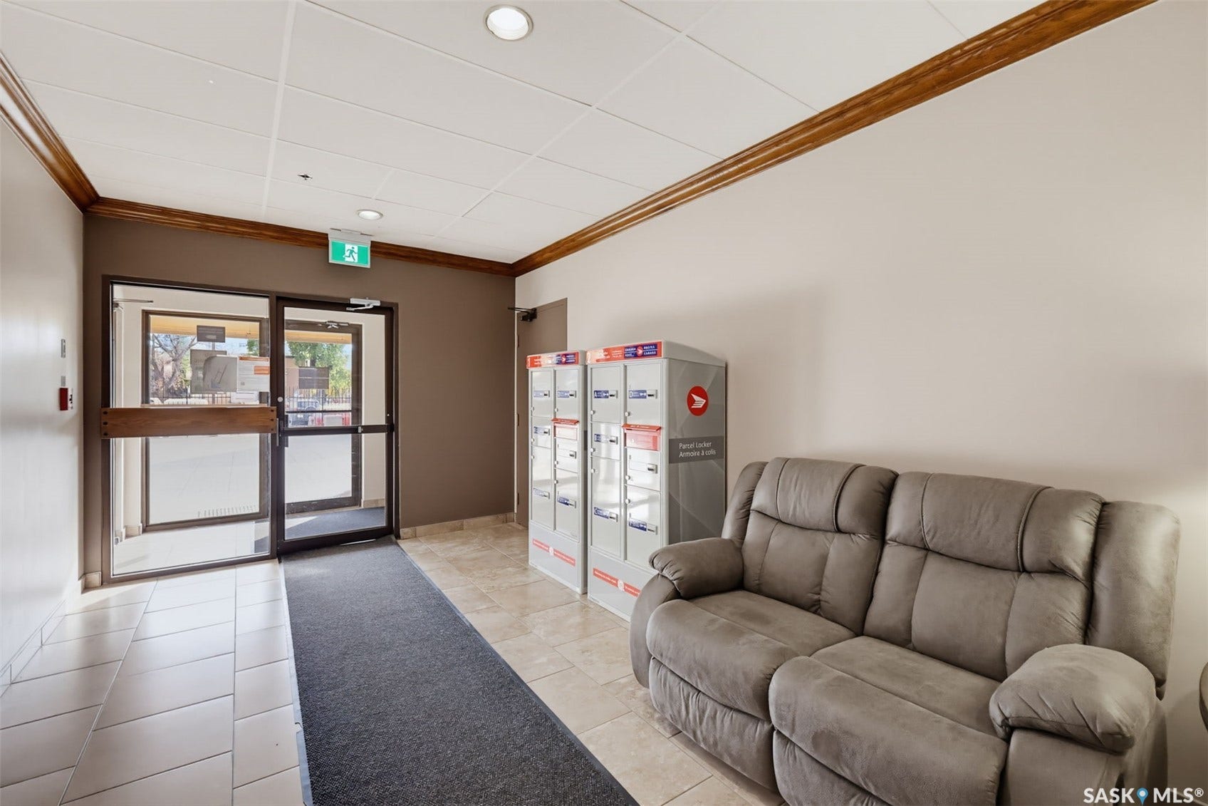 Tile flooring, drop ceiling, recessed lighting, double glass entry doors, decorative wood trim